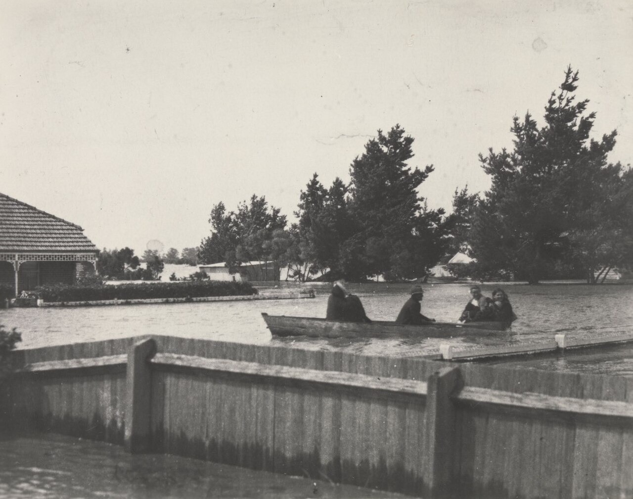 File photo: File photo of people traveling by boat along a flooded street during the 1934 Victorian floods in Koo Wee Rup, Australia. Illustrative context; not a photograph of the reported event.